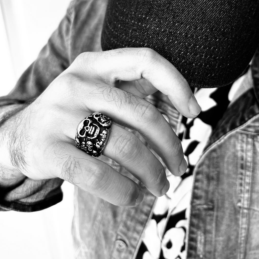 Stainless Steel Polished Multiple Skulls Ring on Man's Hand