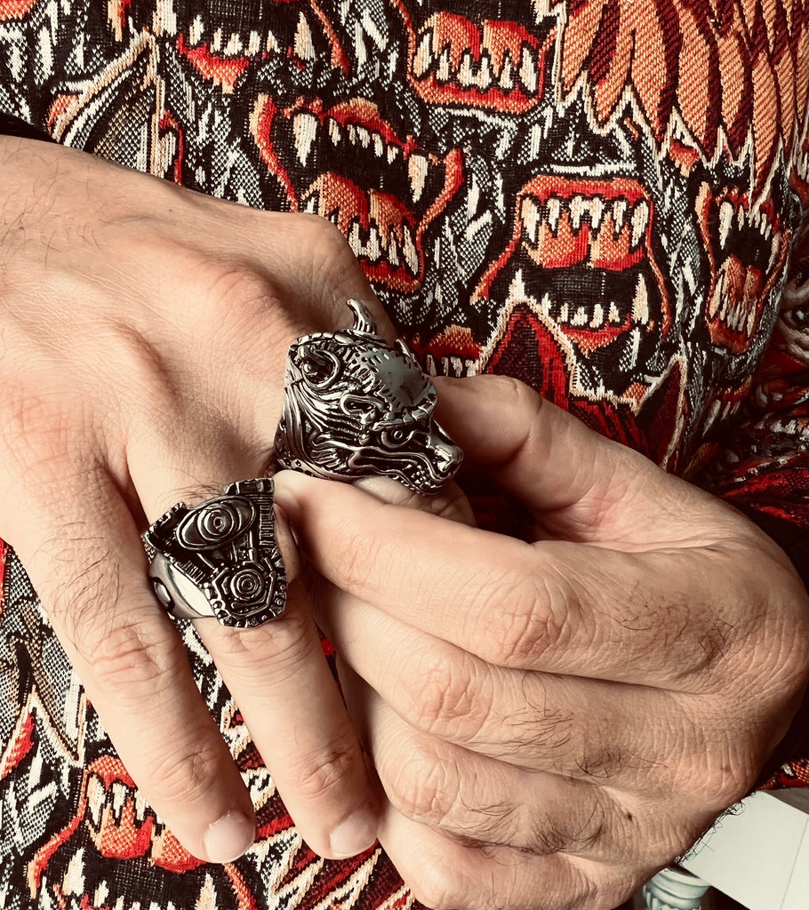 Stainless Steel Motorcycle Engine With Skull Accents Ring on Man's Hand